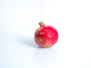 Pomegranate isolated on white background with clipping path and full depth of field.