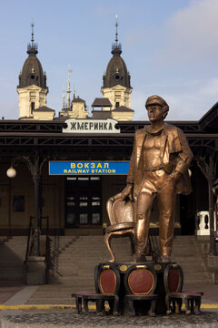 Zhmerinka, Ukraine - November 10, 2019. Monument to Ostap Bender - the hero from the book "12 Chairs" (Ilf and Petrov). Ostap Bender in the photo of the old railway station.