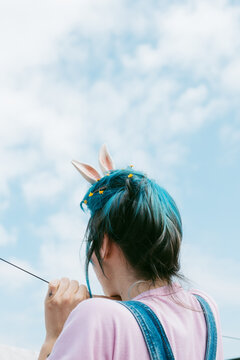 anonymous woman with rabbit ears .