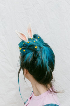 anonymous woman with rabbit ears .