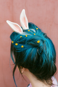 anonymous woman with rabbit ears .