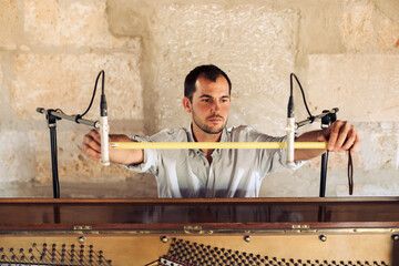 Sound technician installing microphones
