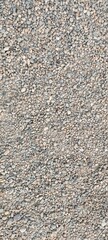 Small gray pebble beach. Backgrounds and textures.