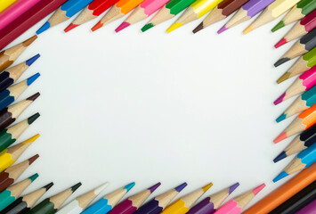 Color pencils on white background, top view with space for text.Frame