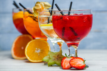 Cocktails and soft drinks. Fruit juice cocktail drink. assorted cocktail drinks. Different cold refreshing cocktails on wooden table