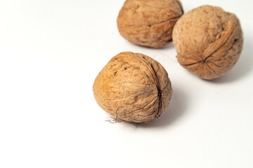 Walnuts isolated on white background. Walnut kernels and whole walnuts