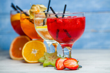 Cocktails and soft drinks. Fruit juice cocktail drink. assorted cocktail drinks. Different cold refreshing cocktails on wooden table