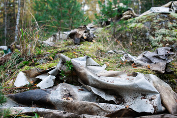 big amount of trash in forest, global environment issues