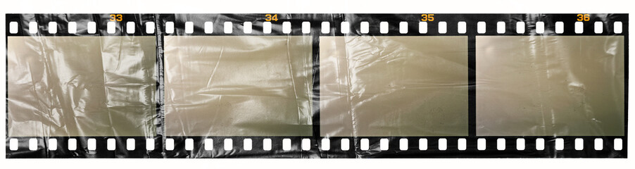 long detailed 35mm dia filmstrip behind real foil material on white. cool photo placeholder.