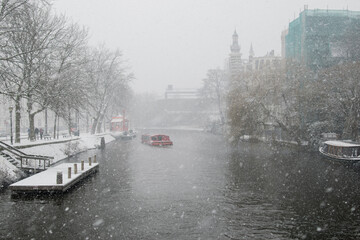 View of the snowy Amsterdam canals in winter.