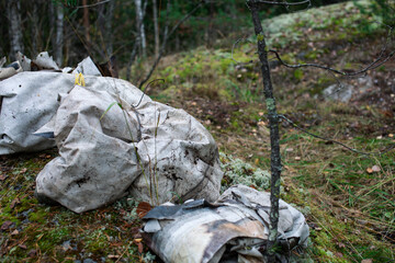 big amount of trash in forest, global environment issues