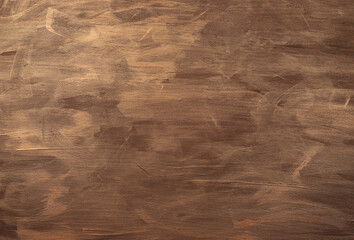 Wooden board painted with gold paint. Background and texture.