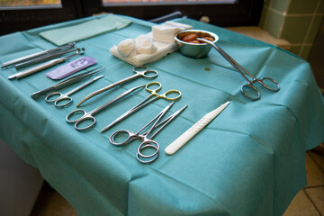 some surgical instruments on a small instrument table for performing an operation