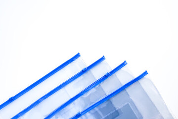 Transparent plastic zipper bags on soft light background