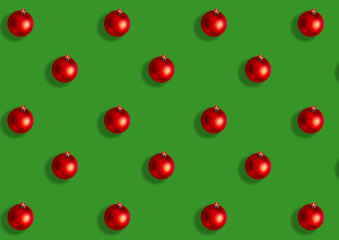 Naklejka na ściany i meble Seamless pattern from large red Christmas balls on a green background. Flat lay