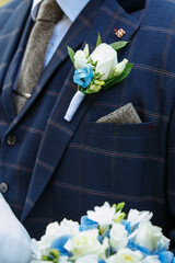 men's suit with a wedding mini bouquet