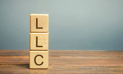 Wooden blocks with LLC - Limited Liability Company. Business concept. Hybrid companies that combine...
