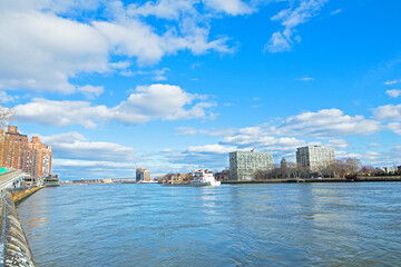 East River panorama with Roosevelt Island on the right and Manhattan on a sunny morning in New York, USA.