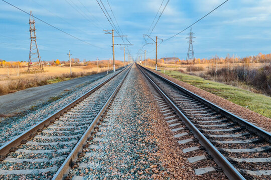 railway, rails and sleepers without trains close-up, on a beautiful sunset overcast sky