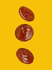 fresh honey pours on the appetizing cake. Blue background