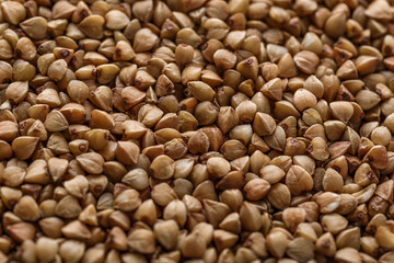 Buckwheat. The concept of diet and healthy eating, the background texture of the buckwheat. Macro photography of buckwheat texture.gluten free ancient grain for healthy diet,top view.
