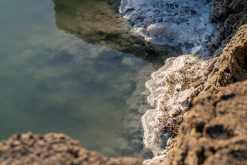 Salt crystalsin the morning sun on the shores of the Dead Sea near Ein Gedi. Israel. 