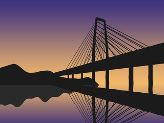 Silhouette of a bridge against the background of dawn
