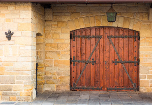 Old textured big doors, old wall with big vintage gates. Wooden door from a barn
