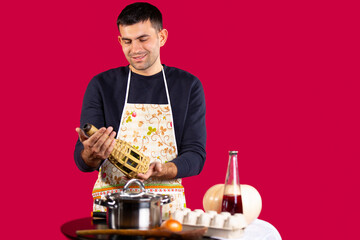 A handsome man has prepared dinner and chooses a suitable drink for the prepared one. Gender...