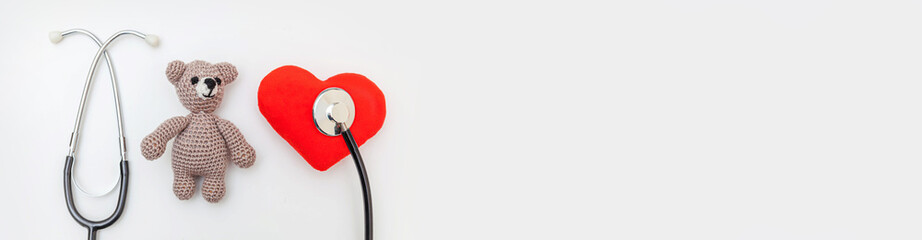 Simply minimal design toy bear red heart and medicine equipment stethoscope isolated on white...