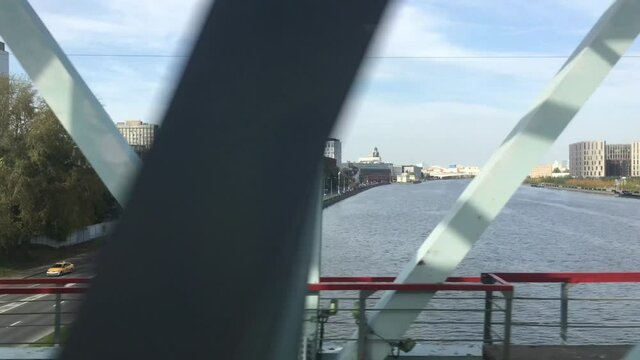 View of the Moscow River near the former ZIL plant from the window of a passing train.