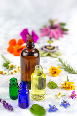 Fototapeta na wymiar Essential Oil with Natural Herbs , and fresh flowers, Alternative Medicine