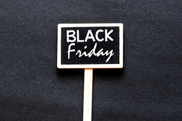 Black Friday words written on chalkboard and black background. Time for promotions and sales in stores.