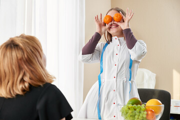 Young girl visiting nutritionist to lose weight with the help of diet program