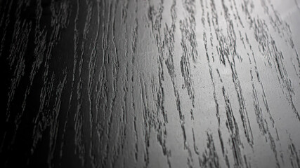 Close-up of an oak wood stained dark brown.