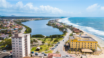 Naklejka na ściany i meble Barra Velha SC. Aerial view of the city, Barra Velha lagoon and Península beach, in Santa Catarina, Brazil