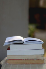 Stack of books on the table. Selective focus.