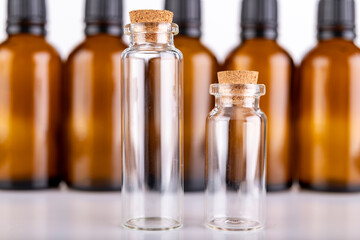 Small glass bottles for storing liquids. Containers used in pharmaceuticals.