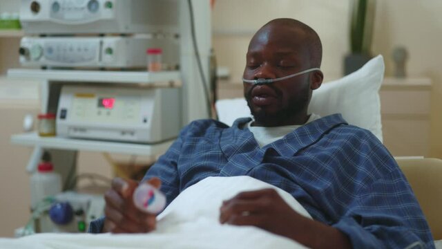 African american patient suffering terrible pain taking wrong medicine tablets dying from overdose. Wrong medications. Lethal incident. Death at hospital. Healthcare.