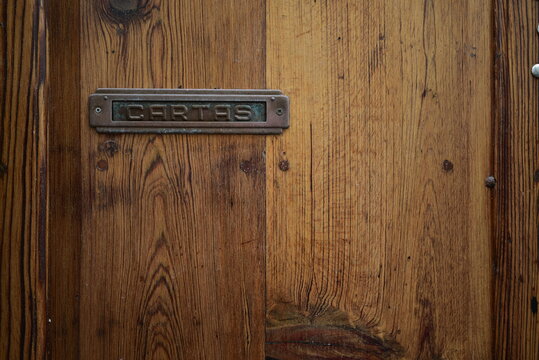 wood door with a hole for mail
