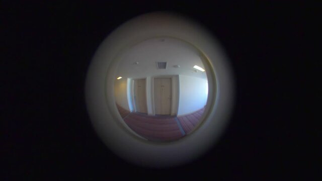 View from the peephole in the door in 4k slow motion 60fps