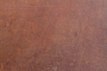 .Background of natural brown old saddle leather with spots - 390251213