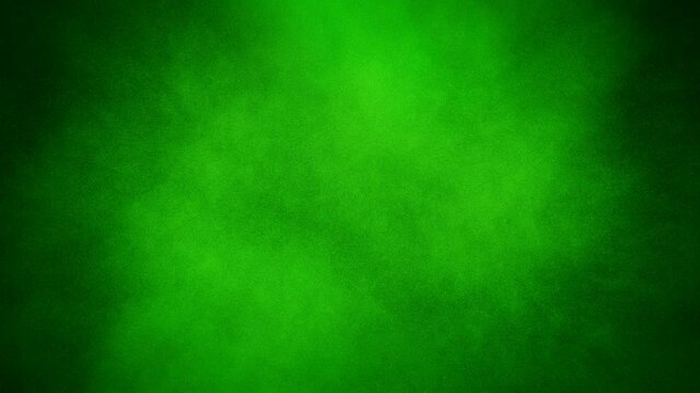 A spray of green paint fills the black background, forming a green chroma key background for inserting your video and vice versa, jets of black paint fills over the green background. Closeup