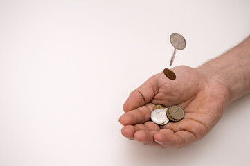 Poor man's hands with russian coins on white background, poverty concept