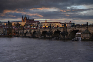Fototapeta na wymiar view of Prague Castle and the Cathedral of St. Vitus and Charles Bridge from the 14th century in the center of Prague at the sunset of the moon and the sky is colored
