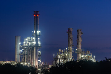 Obraz na płótnie Canvas Oil refinery industry at sunset - factory - petrochemical plant