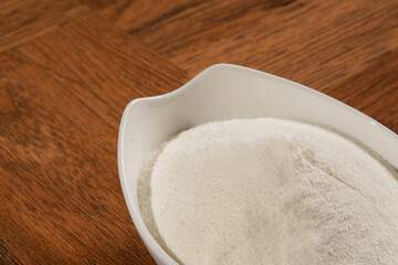 Collagen Protein - Hydrolyzed - Collagen Capsules - Collagen on wooden background.