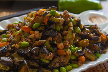 Stir fry eggplant with soybeans close up. Chinese food.
