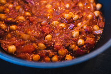 plant-based food, vegan moroccan chickpea stew with tomato sauce onion an carrots