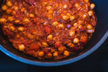 plant-based food, vegan moroccan chickpea stew with tomato sauce onion an carrots